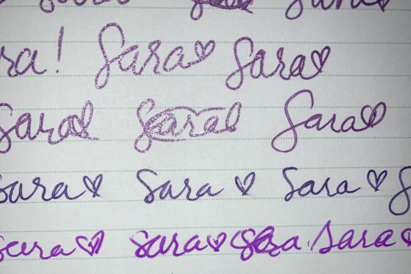 Doodles Maegan wrote of Sara's name in various shades of purple and pink