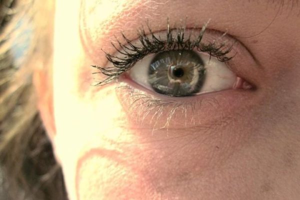 Up close shot of Maegan's eye with the sunlight shining on the side of her face